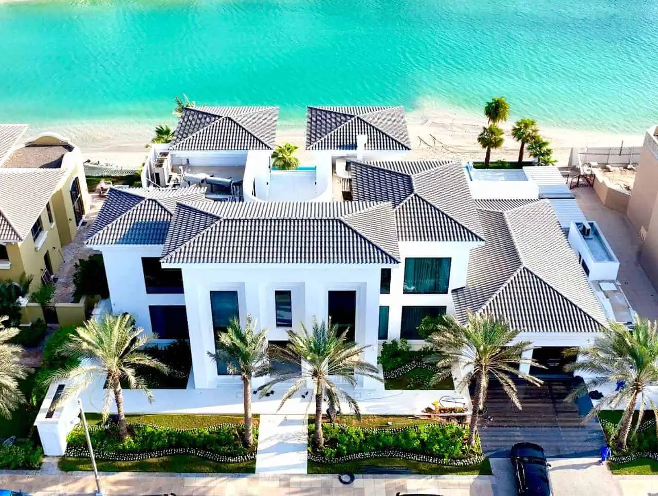 A breathtaking aerial view of a luxurious beachfront home, offering the perfect blend of elegance and tranquility.