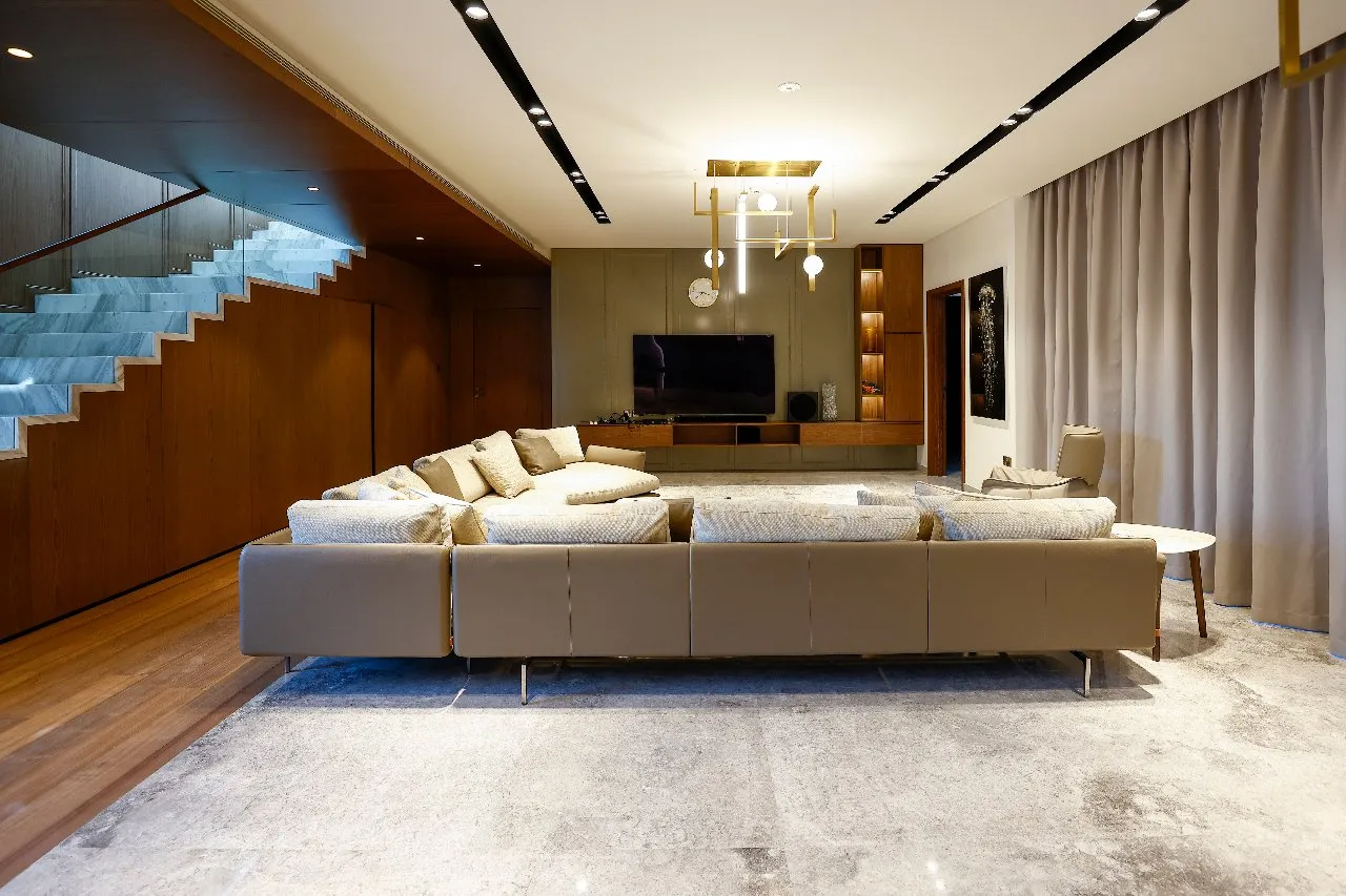 A cozy living room with a spacious sectional sofa, perfect for relaxation and entertaining guests.