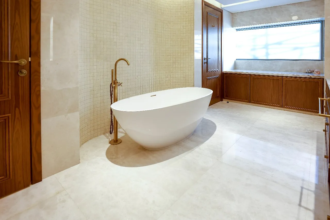 a bathroom with a tub and a shower