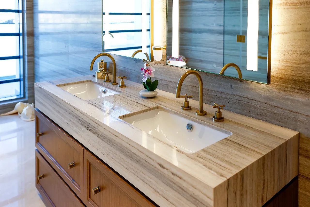 Two sinks and a mirror in a bathroom.