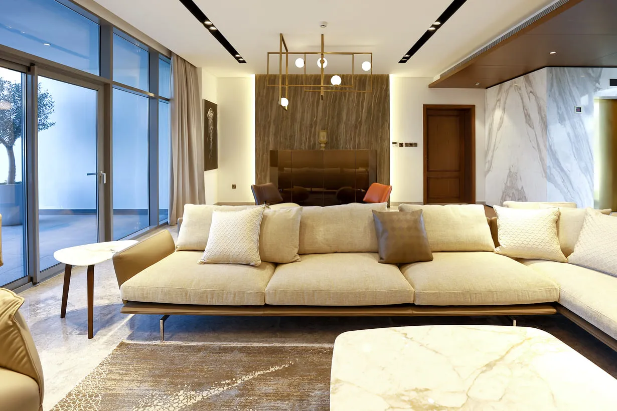 A cozy living room with a spacious sectional sofa, perfect for relaxation and entertaining guests.