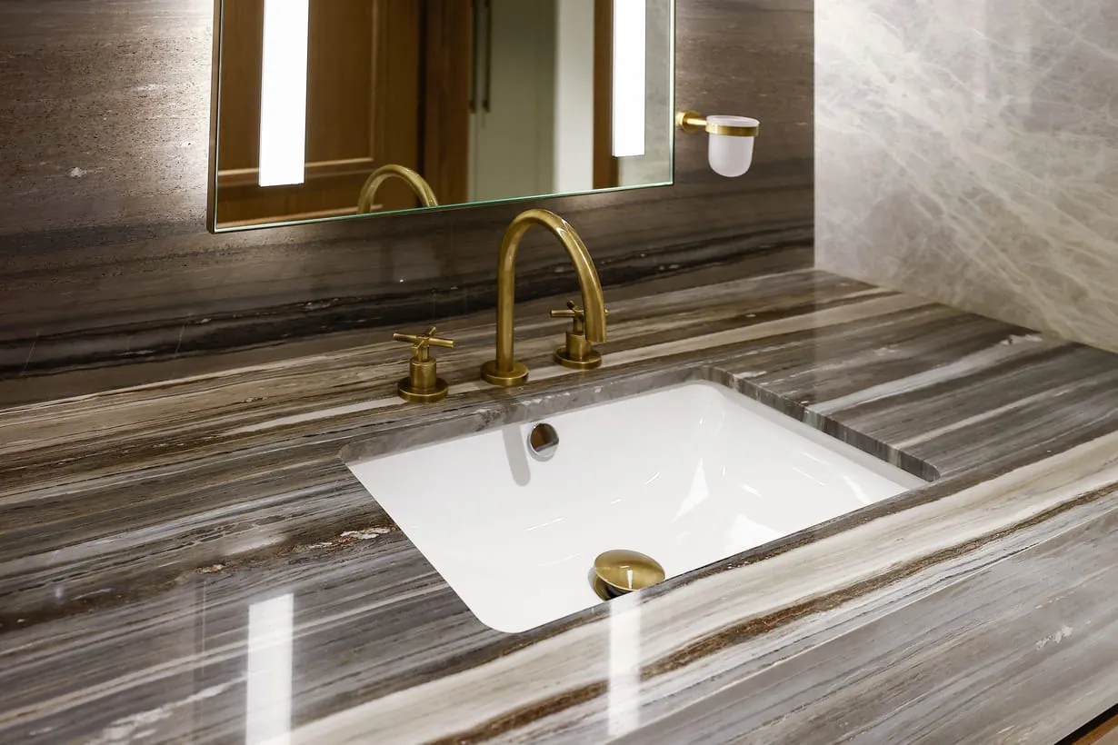 a sink and mirror in a bathroom