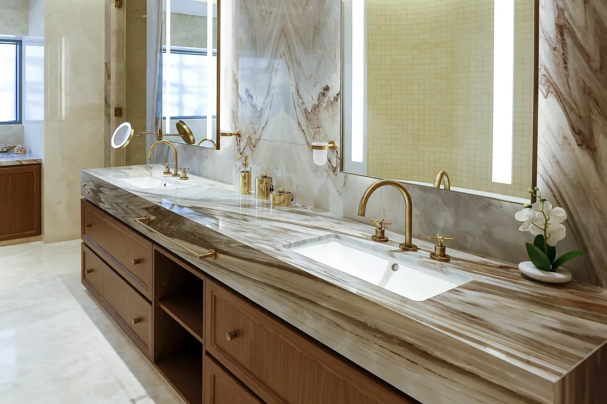 Two sinks and a mirror in a bathroom.