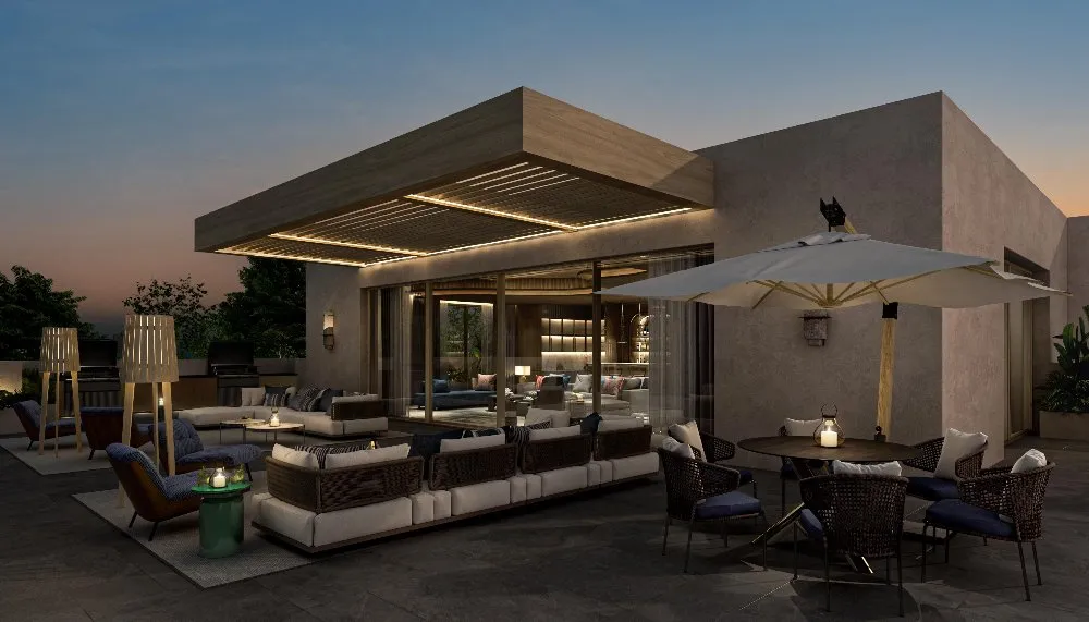 Serene outdoor patio at the resort, surrounded by lush greenery and cozy seating areas.